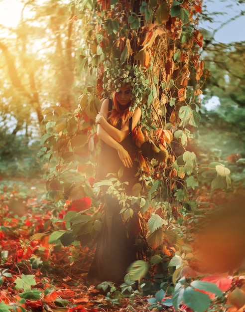 Vertical photo of cute young lady in forest with hop on head outdoors