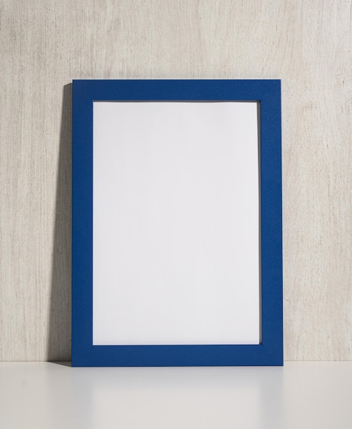 Vertical photo frame mockup on beige wall blank diploma frame on white wall background Picture frame mockup blank diploma frame on white wall background Size a3 a4 copy space