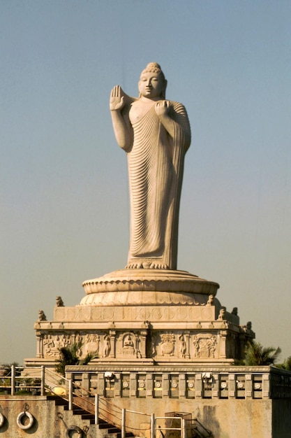 Vertical shot of a Buddha statue on the Hussain Sagar lake in India