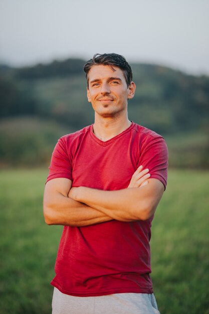 Vertical shot of a caucasian male with a red t-shirt