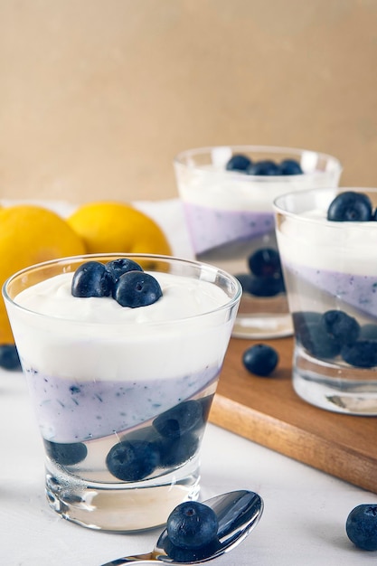 Vertical shot of a healthy breakfast with fresh blueberries and yogurt