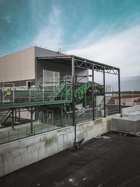 Vertical shot of an industrial landscape with factory and production lines outdoors