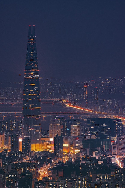 Vertical shot of the magnificent Lotte Tower captured at night in Seoul, South Korea