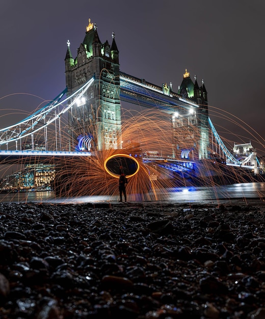 Vertical shot of Tower Bridge at night London United Kingdom