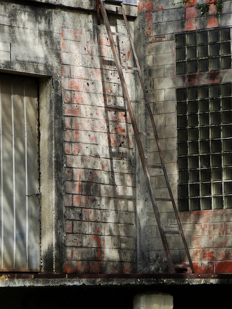 Vertical shot of the weathered walls of an abandoned building