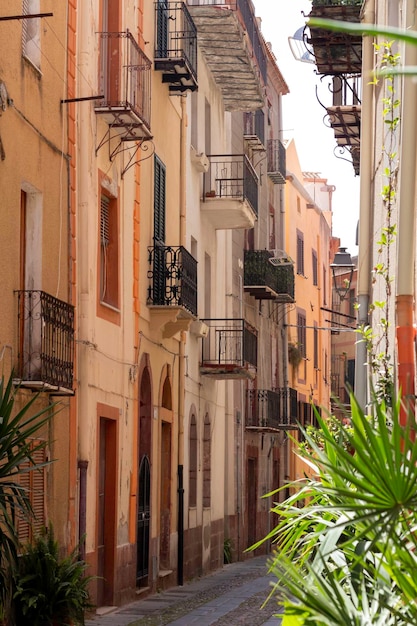 Vertical view of narrow streets with traditional color houses in Bosa Sardinia Italy