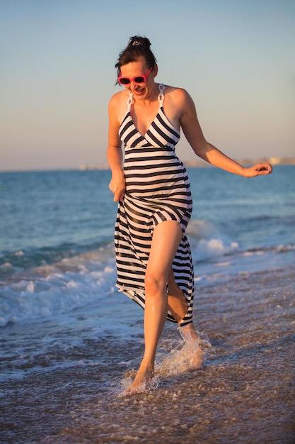 Vertically elderly beautiful woman at sea