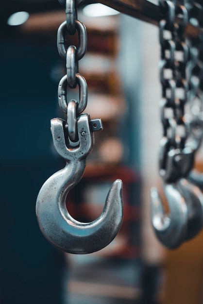 Verticl view of lifting hook in an industrial warehouse