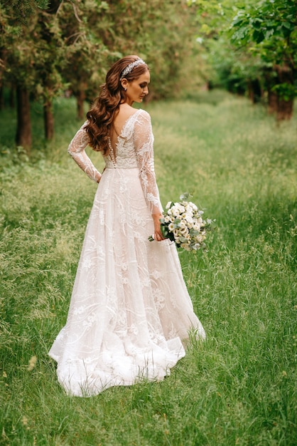 a very beautiful bride with flowers in her hand