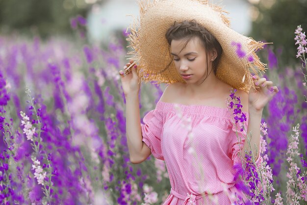 Very beautiful young woman with flowers. Close up portrait of attractive female