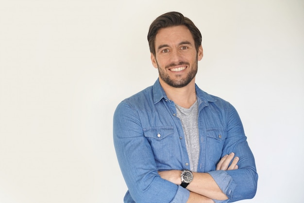 Very handsome casual man smiling and standing 