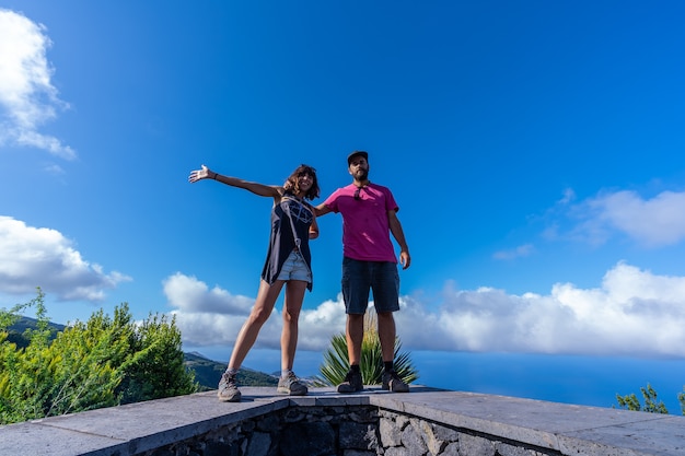 A very happy couple on top of the mountain at the viewpoint of the Cubo de la Galga