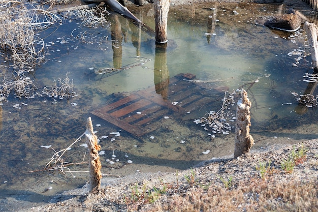 A very heavily polluted stream Natural reservoirs suffer from human economic activity