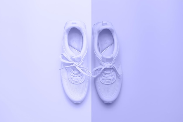 Very Peri color of the Year 2022 Sneakers on lilac Trendy athletics and sport minimal concept