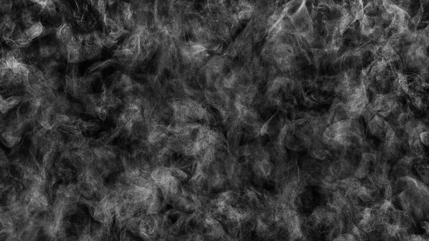 Very small drops of steam in chaotic motion on black texture background