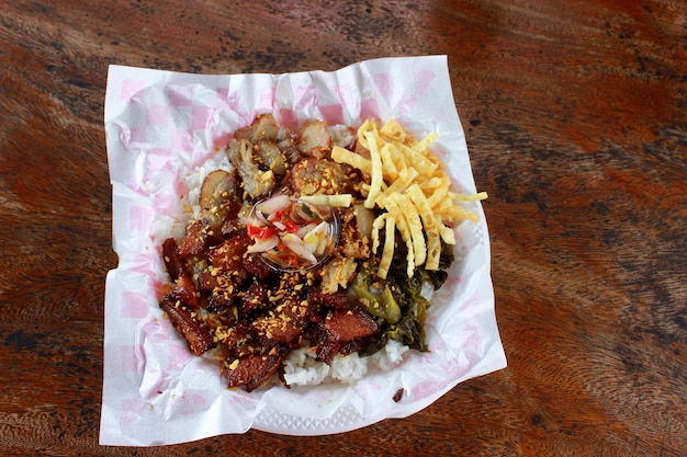 Very tasty pork mixed rice on a wooden table