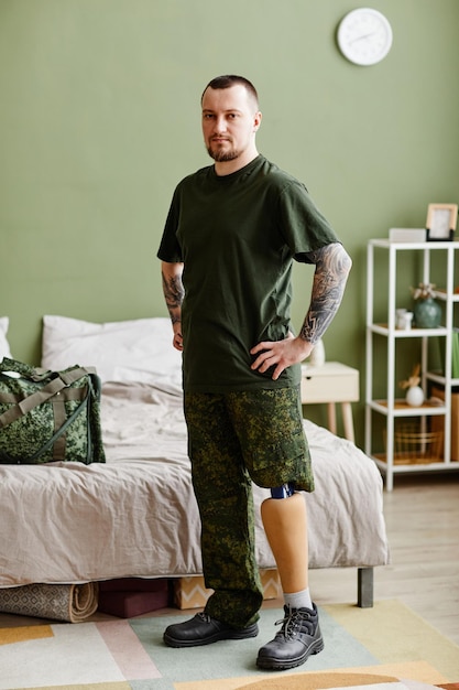 Veteran with prosthetic leg wearing army uniform