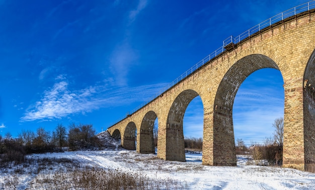 Viaduct in Plebanivka village, Terebovlyanskiy district of Ukraine, on a sunny winter day