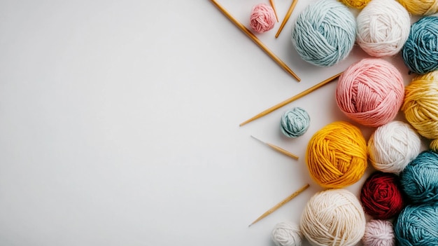 Photo a vibrant collection of colorful yarn balls with knitting needles for creative craft projects