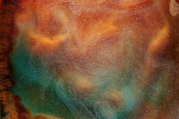 Vibrant colors of outer space ocean pattern abstract background Mixing paint and liquid smoke colorful splash and swirl of drops underwater mystical backdrop