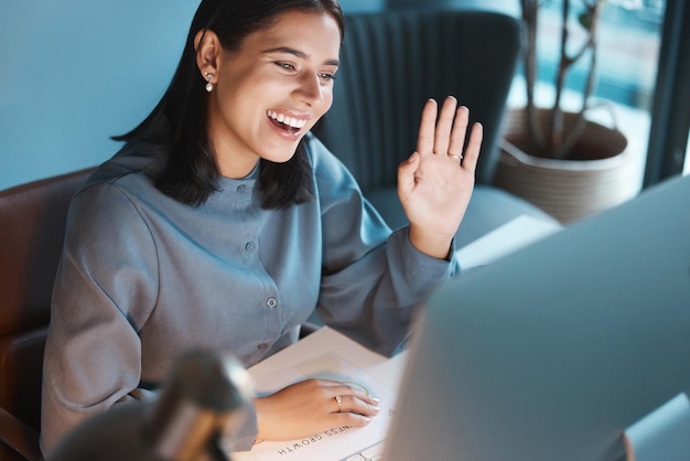 Video call wave and computer with business woman in office for social networking communication and webinar Online meeting technology and management with employee hello for virtual conference