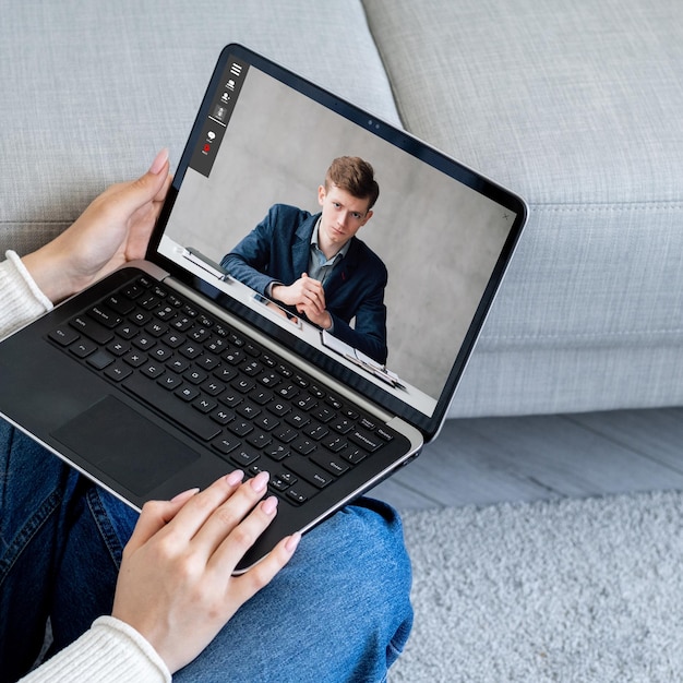 Video chat employee working from home on laptop