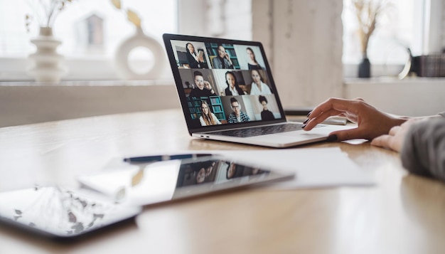 Video chat online on a laptop a woman in the office is working