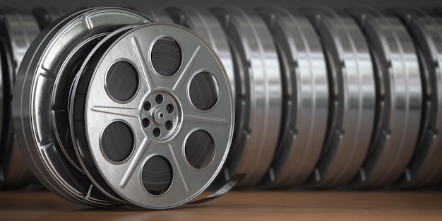 Video cinema movie multimedia concept A row of vintage film reel or film spools with filmstrip