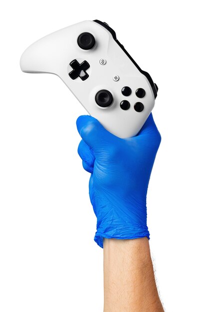 Video game console controller in gamer gloved hands. Games during isolation at home, coronavirus