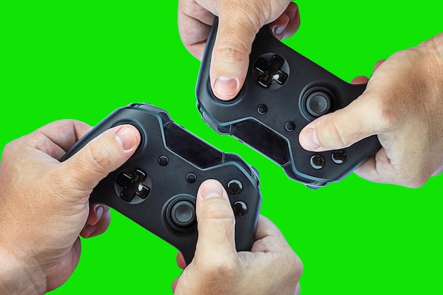 Video game controller and game controller. Green background. Selective focus. Space for text.