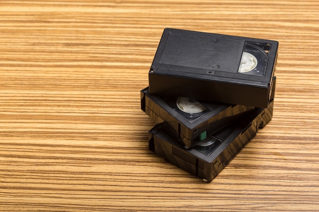 Video tape cassette over wooden 