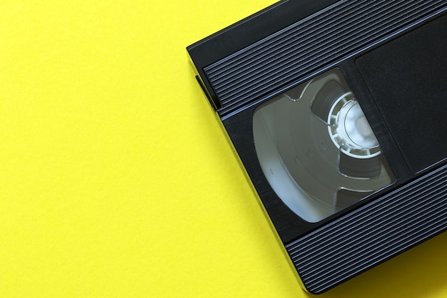 Video tape cassette on yellow color background