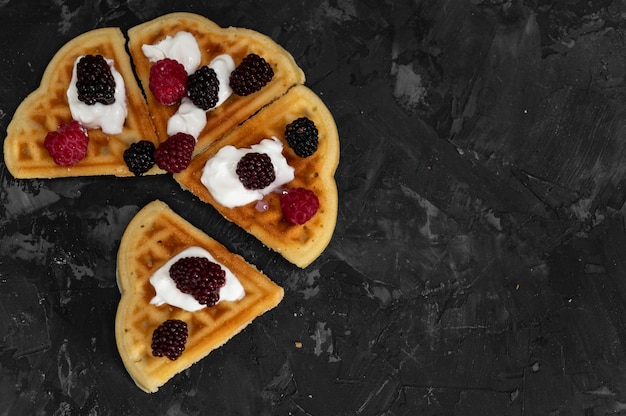 Viennese waffles on a dark gray background, top view