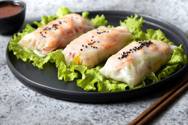 Vietnamese food spring rolls with shrimps on grey Close up Asian cuisine