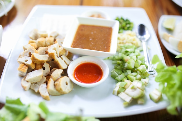 Vietnamese Meatball Wraps (Nam Neung), Vietnamese Pork Sausage and salad.