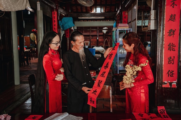 Vietnamese scholar writes calligraphy at Long Son Calligraphy festival is a popular tradition during Tet holiday Writing couplets for Spring Festival new year