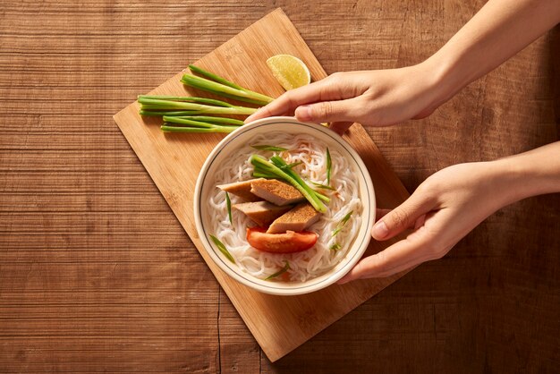 Vietnamese soup containing rice vermicelli and grilled chopped fish