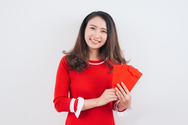 Vietnamese woman with lucky money envelopes for lunar new year