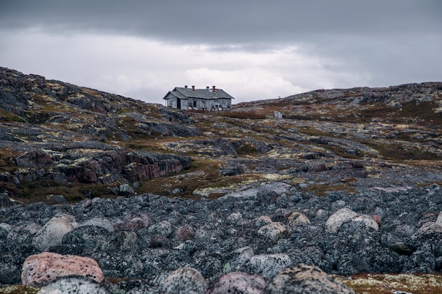 View of an abandoned house on a hill