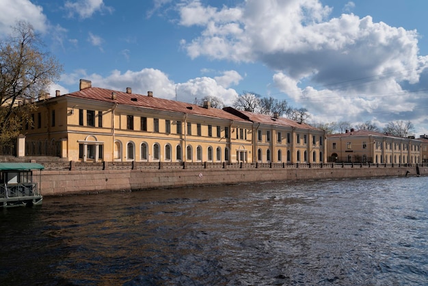 View of the academic buildings of the AI Herzen Russian State Pedagogical University on the Moika River embankment on a sunny day Saint Petersburg Russia