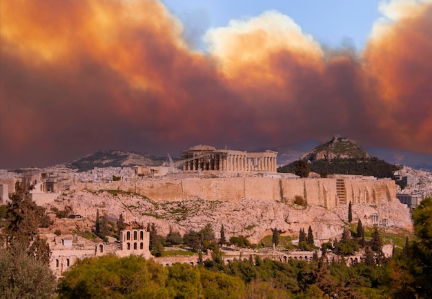 View of the Acropolis and the Parthenon against the background of smoke from fires in Athens Greece