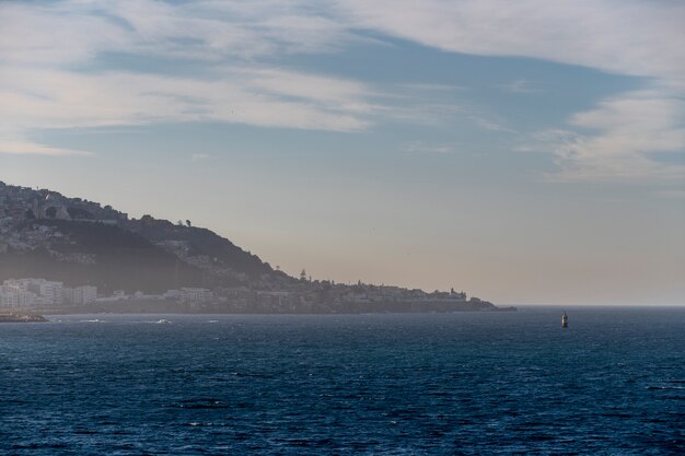 View to Algiers port at sunset. Calm weather. View from vessel.