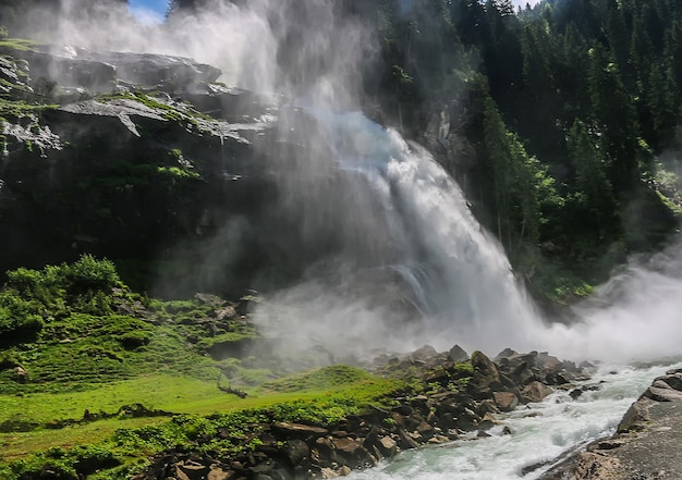 View Alpine inspiring Krimml waterfall in mountains in summer day. Trekking in National park Hohe Tauern, Austria