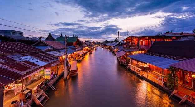 View of Amphawa Floating Market Towns and tourists walk shopping eat and take pictures around