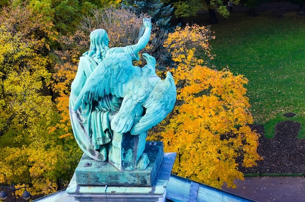 View of the ancient statues man and eagle of stucco and the dome of St. Isaac's Cathedral Petersburg.