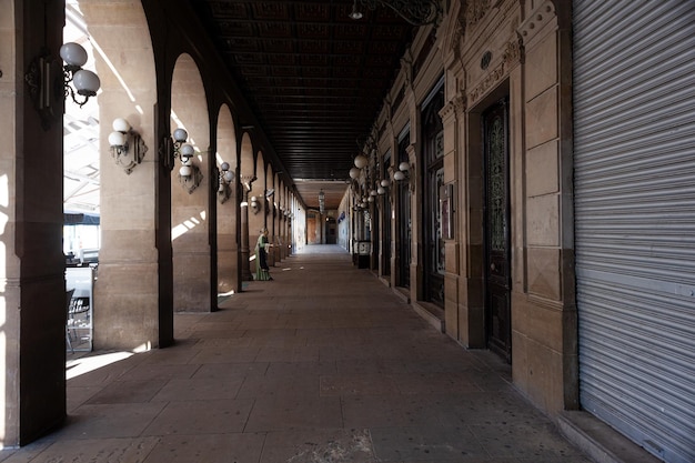 View of the arched colonnade of Plaza del Castillo square in Old Town of Pamplona Navarre Spain