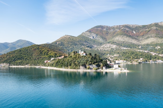 View of Bay of Kotor from the sea surrounded by mountains in Montenegro, one of the most beautiful bay in the world.