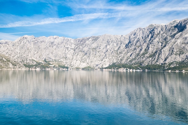 View of Bay of Kotor from the sea surrounded by mountains in Montenegro, one of the most beautiful bay in the world.