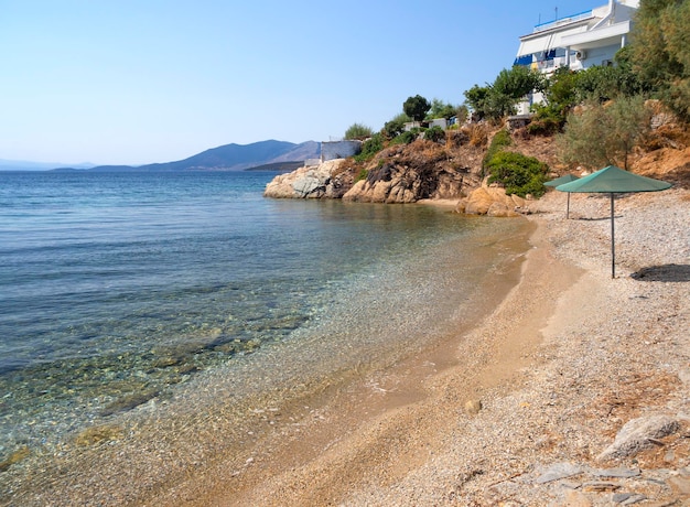 View of beach in Aegean sea near the town Marmari on Greek island Evia in Greece on a Sunny day