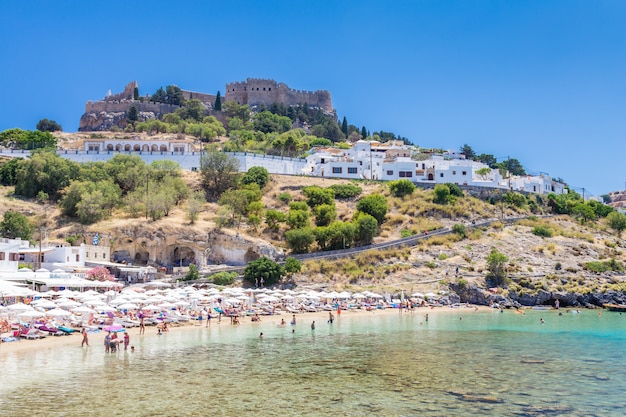 View of the beach ant the fortress in Lindos town. Rhodes, Greece